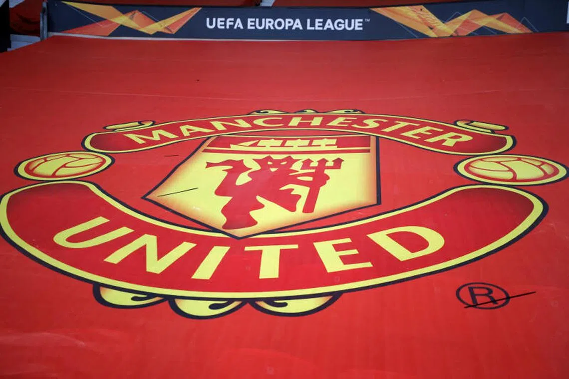 FILE PHOTO: Soccer Football - Europa League - Round of 16 First Leg - Manchester United v AC Milan - Old Trafford, Manchester, Britain - March 11, 2021 General view of the crest of Manchester United inside the stadium before the match REUTERS/Phil Noble/File Photo