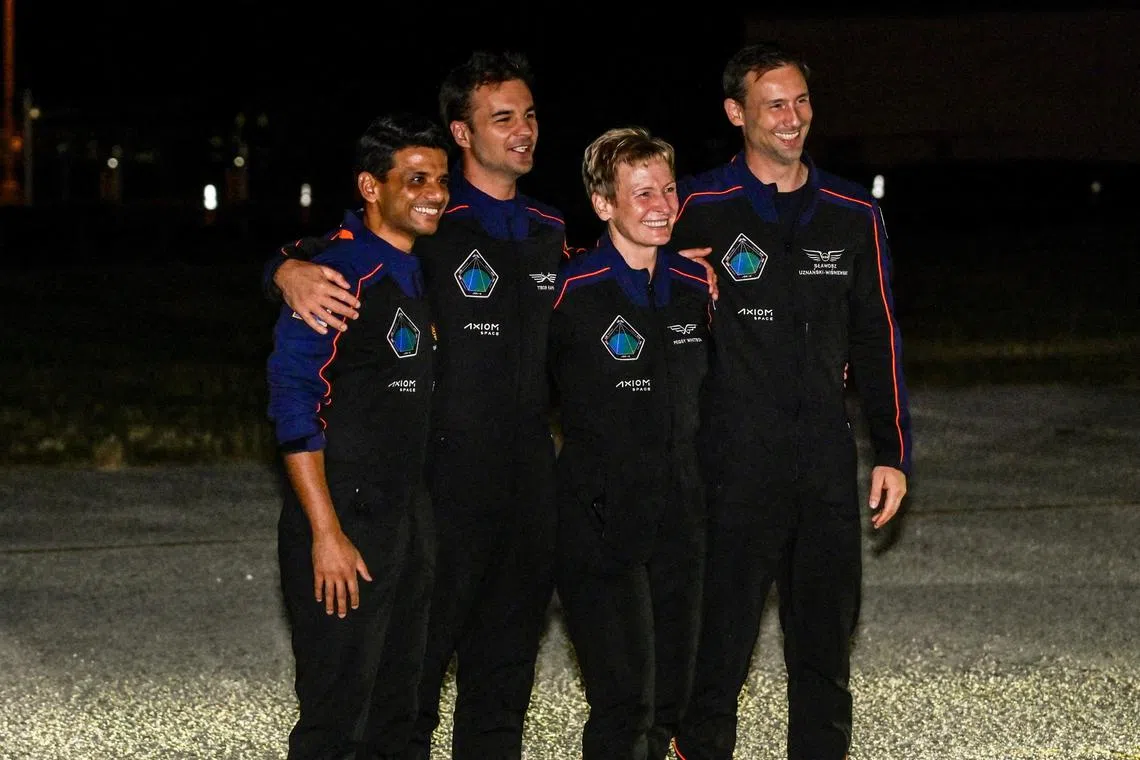 FILE PHOTO: The Axiom-4 crew, Pilot Shubhanshu Shukla of India, Mission Specialist Tibor Kapu of Hungary, Commander Peggy Whitson of the U.S., and Mission Specialist Slawosz Uznanski-Wisniewski of Poland, react as they greet their family members before their mission to the International Space Station, in Cape Canaveral, Florida, U.S., June 24, 2025. REUTERS/Steve Nesius/File Photo