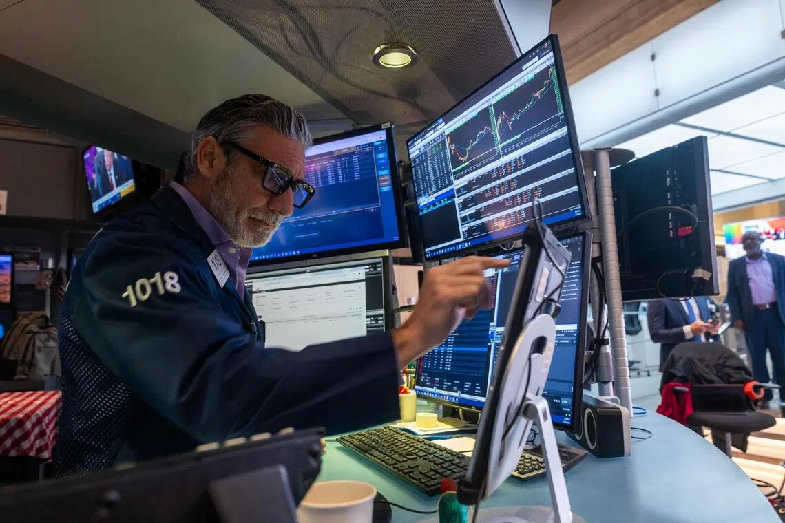 Traders working on the floor of the New York Stock Exchange on Nov 7, in New York City.