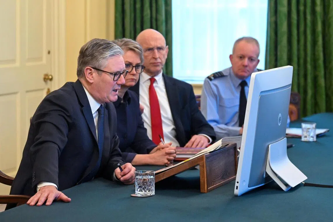 (From left) British Prime Minister Keir Starmer, Foreign Secretary Yvette Cooper, Defence Secretary John Healey and Chief of Defence Staff Rich Knighton taking part in a virtual meeting of the Coalition of the Willing, in London, on Nov 25.