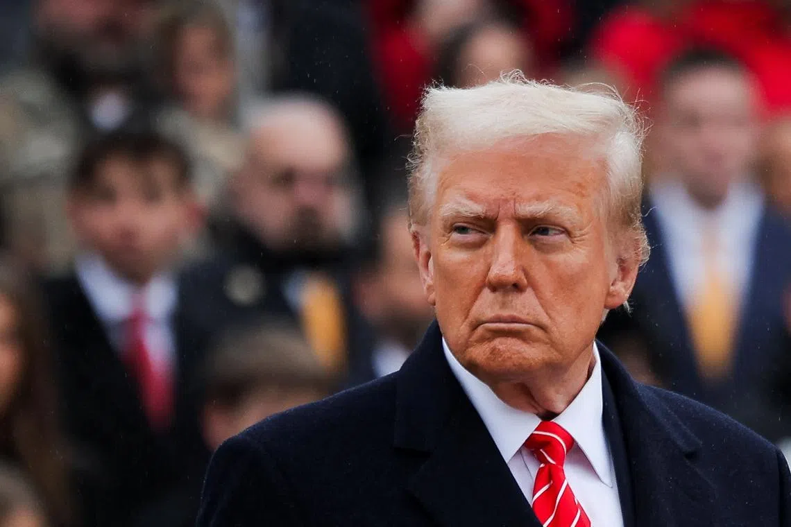 FILE PHOTO: U.S. President-elect Donald Trump attends a wreath laying ceremony at Arlington National Cemetery ahead of the presidential inauguration in Arlington, Virginia, U.S. January 19, 2025.  REUTERS/Carlos Barria/File Photo