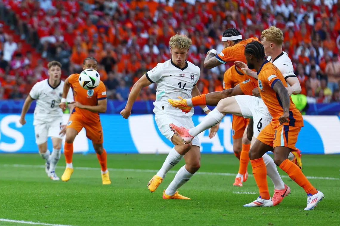 Soccer Football - Euro 2024 - Group D - Netherlands v Austria - Berlin Olympiastadion, Berlin, Germany - June 25, 2024 Netherlands' Memphis Depay scores their second goal REUTERS/Lisi Niesner