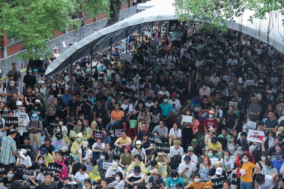 People gather outside the parliament during parliamentary session in Taipei, Taiwan May 21, 2024. REUTERS/Ann Wang