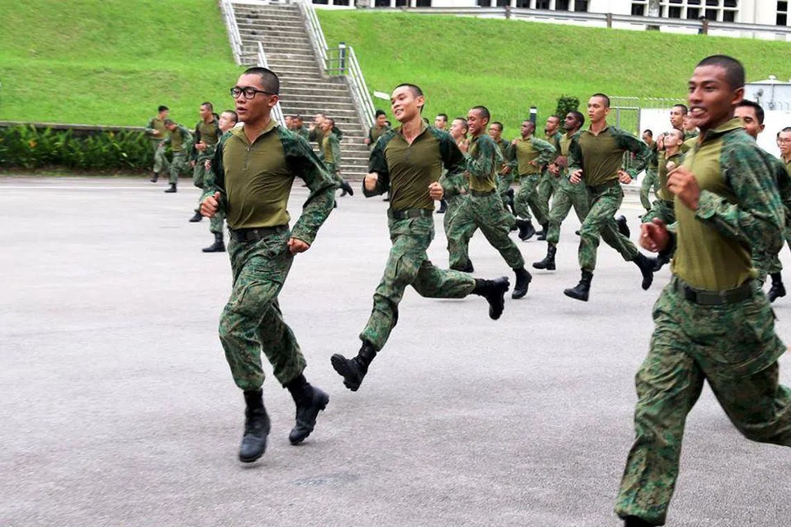 Singapore Armed Forces personnel carrying out a combat physical training exercise in their hybrid uniform, which has been designed to provide better comfort and heat dissipation.