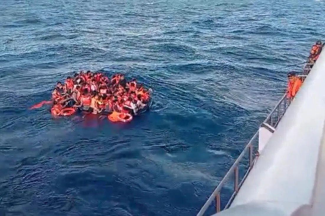 Rescuers comb waters near Bali for 5 missing after ferry blaze