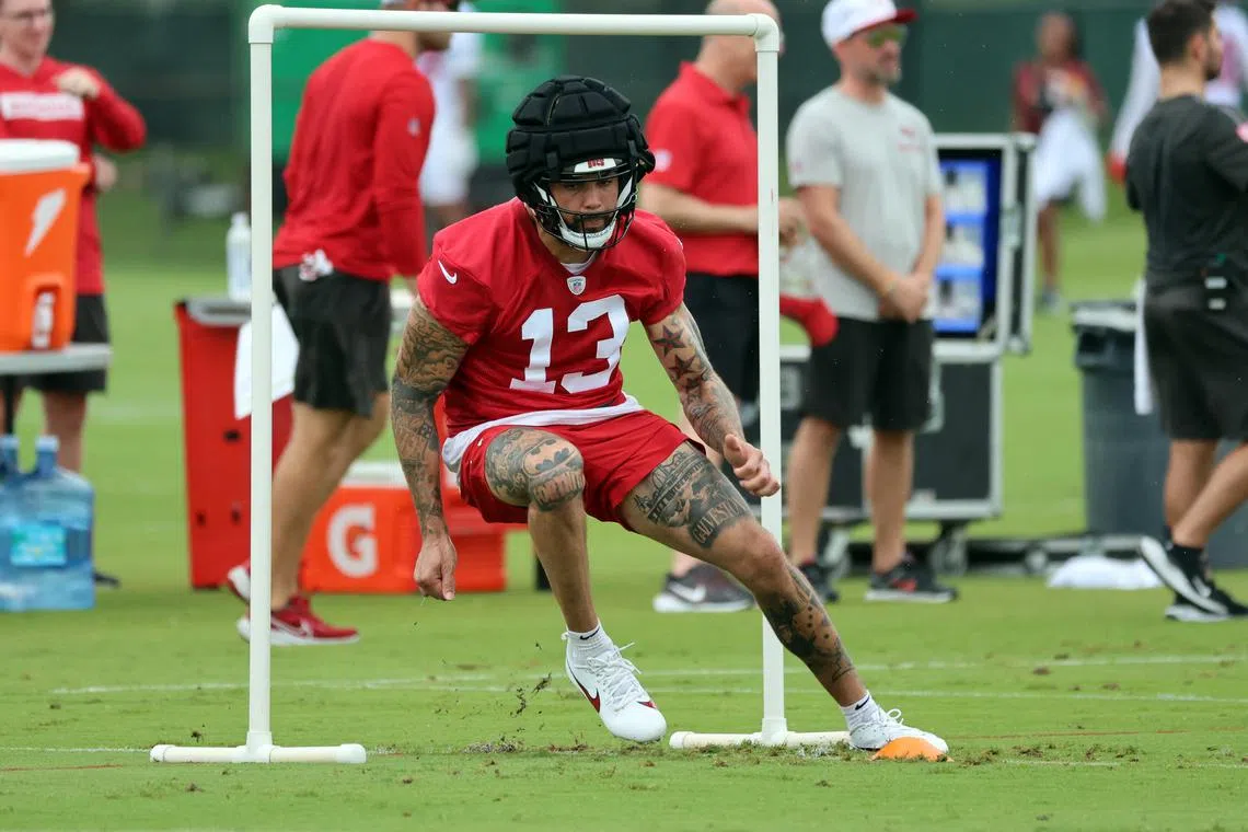 Jul 25, 2024; Tampa, FL, USA;  Tampa Bay Buccaneers wide receiver Mike Evans (13) works out during training camp at AdventHealth Training Center. Mandatory Credit: Kim Klement Neitzel-USA TODAY Sports/ File Photo
