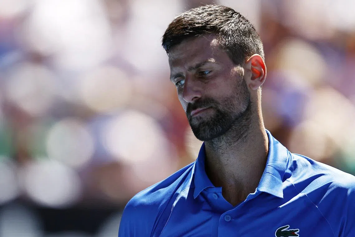 Tennis - Australian Open - Melbourne Park, Melbourne, Australia - January 24, 2025 Serbia's Novak Djokovic reacts during his semi final match against Germany's Alexander Zverev REUTERS/Tingshu Wang