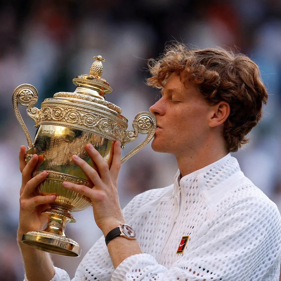 Italy’s Jannik Sinner celebrates with the trophy after winning his final match against Germany’s Alexander Zverev.