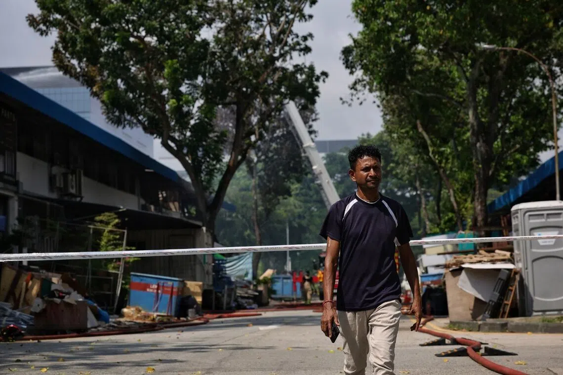 Mr Jhantu Ghosh returning to the scene to check on the situation at 1079 Eunos Avenue 7 on Nov 2.