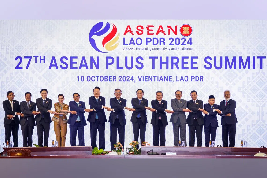 PM Lawrence Wong (third from left) with fellow Asean leaders, as well as South Korean President Yoon Suk-yeol (sixth from left), Japan PM Shigeru Ishiba (centre) and Chinese PM Li Qiang (fifth from right), at the Asean Plus Three summit in Vientiane on Oct 10.