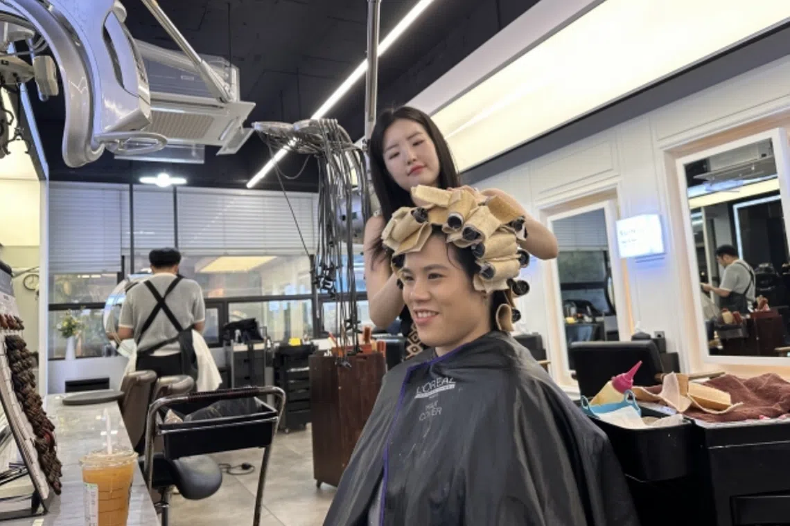 Ms Janell Ng from New Zealand is getting her hair done in a hair salon in Gangnam-gu, Seoul.