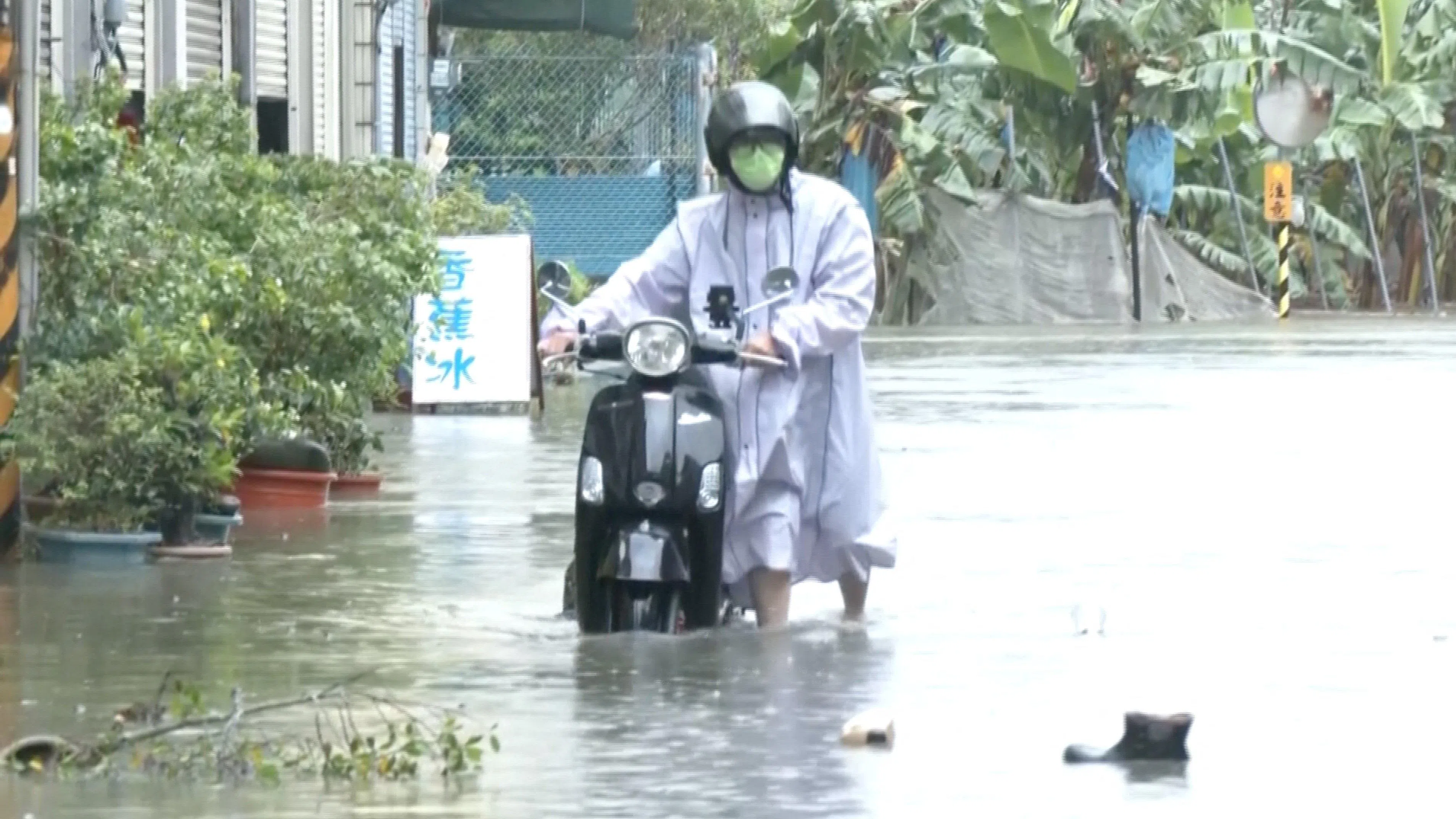 Floodwater during heavy rain caused by the nearby passing of Typhoon Mekkhala, as it heads towards Japan, in Kaohsiung, Taiwan, on June 25.
