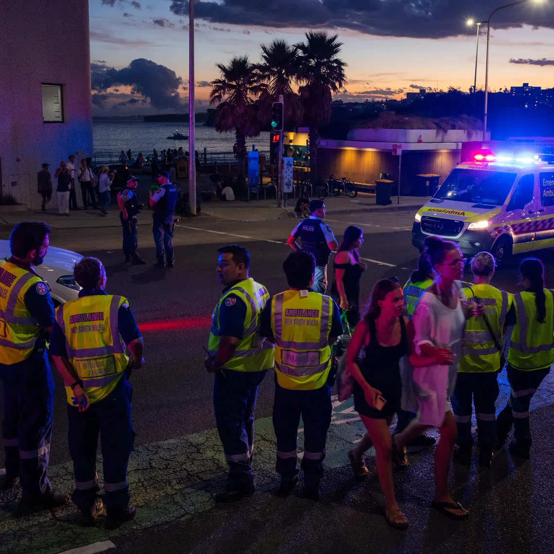 Police and paramedics at the site of a shooting at Bondi Beach in Sydney on Dec 14.