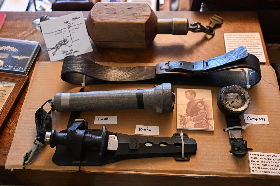 Winson Wong’s diving belt (top, in black), among other tools he used when he was in the naval diving unit.