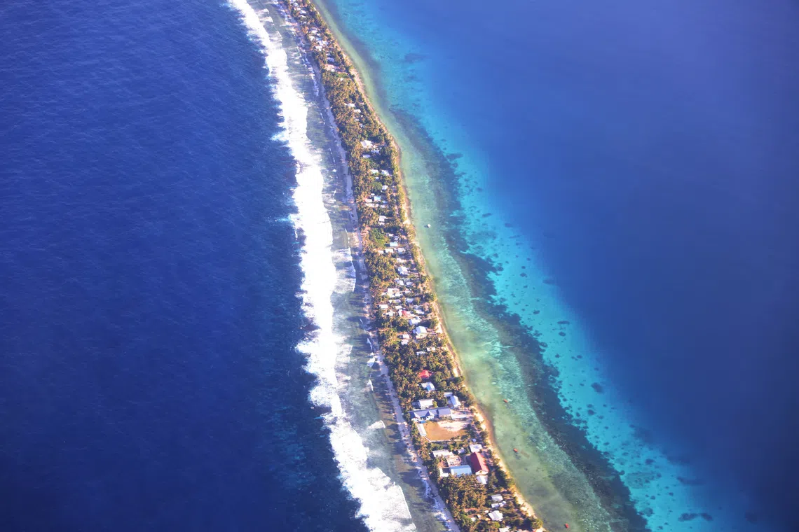 Aerial view of Funafuti, Tuvalu’s most populous island, September 6, 2024. Picture taken through plane window. REUTERS/Kirsty Needham