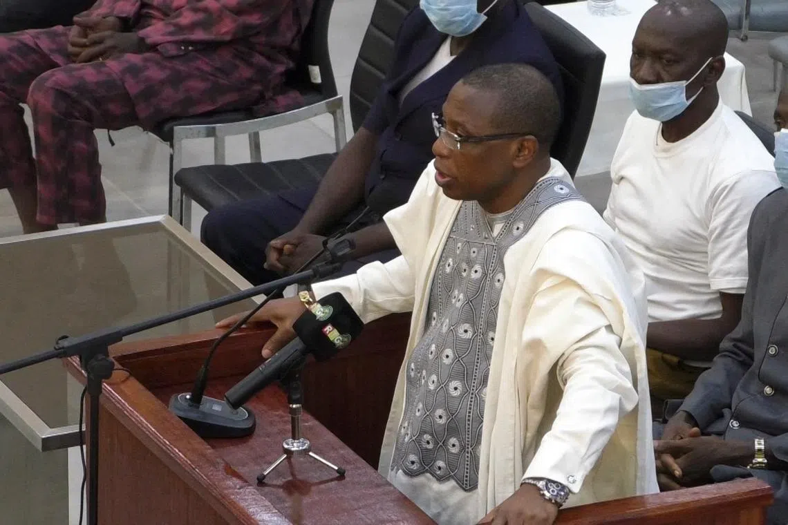 FILE PHOTO: Guinea's former President Moussa Dadis Camara, who is accused of responsibility for the 2009 massacre and mass rape of pro-democracy protesters by forces linked to a former military junta, talks during his trial in Conakry, Guinea September 28, 2022. REUTERS/Souleymane Camara/File Photo