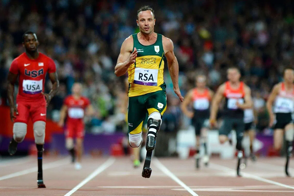 Oscar Pistorius runs across the finish line at the London 2012 Paralympic Games at the Olympic Stadium in east London on Sept 5, 2012. 