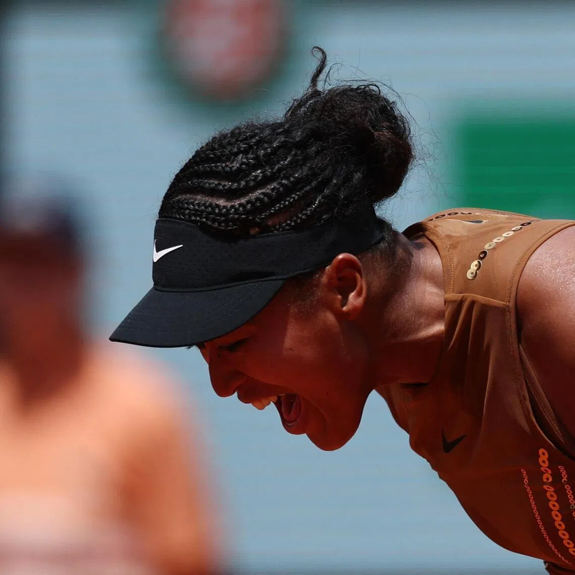 Japan's Naomi Osaka reacting during her 7-6 (7-5), 6-7 (3-7), 6-4 third-round win over Iva Jovic of the US at the French Open at Roland Garros in Paris on May 30, 2026.