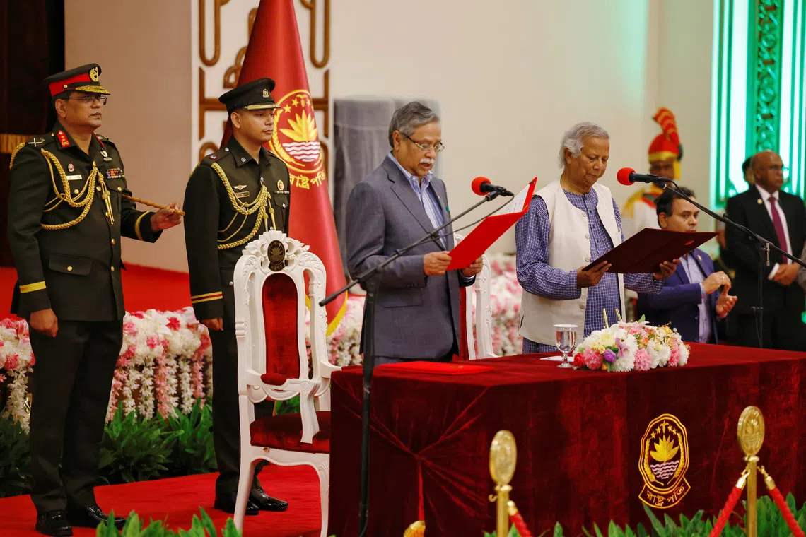 Bangladeshi President Mohammed Shahabuddin (left) administering the oath-taking ceremony of Nobel laureate Muhammad Yunus as the country’s head of the interim government in Dhaka in August.