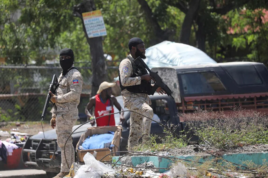 FILE PHOTO: Police officers stand guard outside the hospital before the arrival of Haiti's Prime Minister Garry Conille to visit police officers and civilians injured in a shooting during a police operation a few days earlier, in Port-au-Prince, Haiti August 28, 2024. REUTERS/Ralph Tedy Erol/File Photo