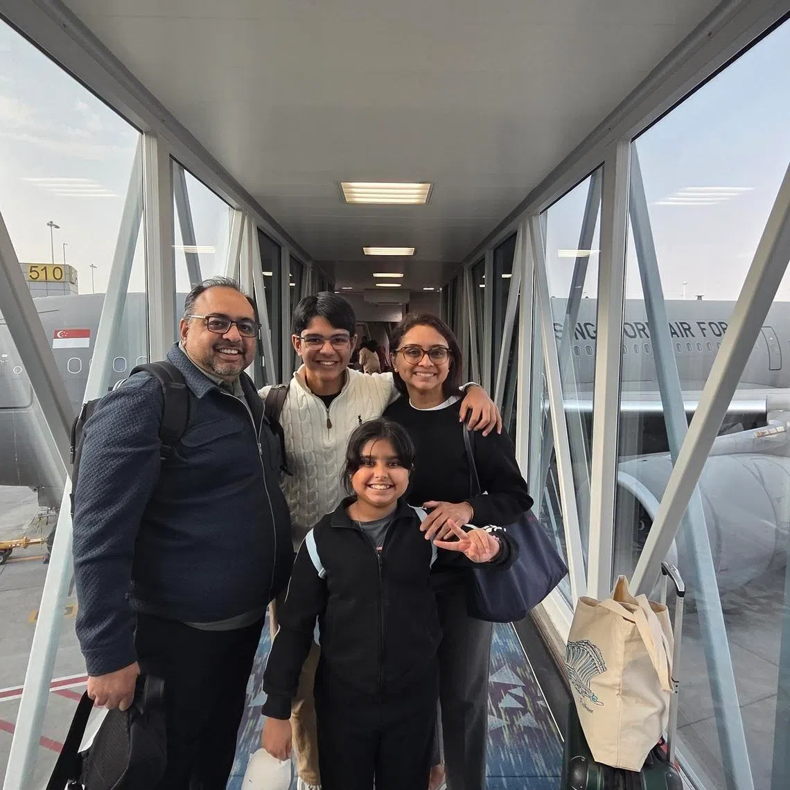 Mr Nisar Keshvani with his wife and children, before boarding the RSAF evacuation flight from Riyadh, Saudi Arabia. 