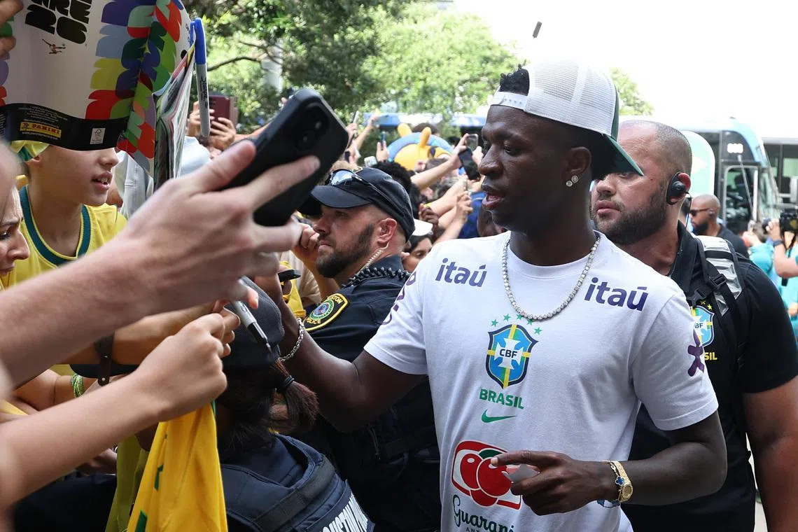 Heat no problem for passionate Brazil fans waiting to greet team in Houston