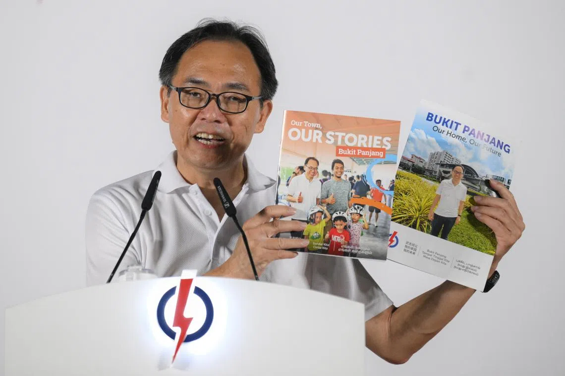 #pap PAP candidate for Bukit Panjang SMC Liang Eng Hwa shows booklets with plans for Bukit Panjang as he speaks during a rally at Beacon Primary School on April 30, 2025.