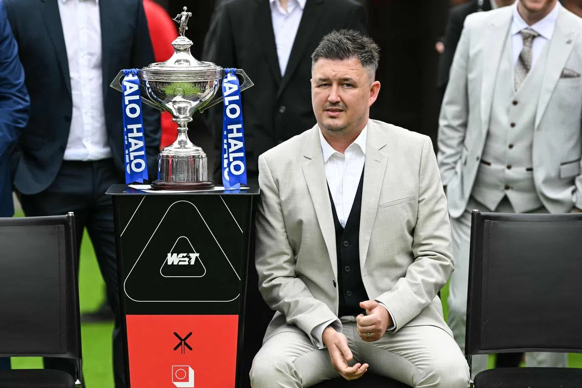 2024 winner Kyren Wilson poses next to the trophy during the photo-call as part of the media day launching the start of the World Snooker Championship 2025 at Crucible Theatre on April 18, 2025.