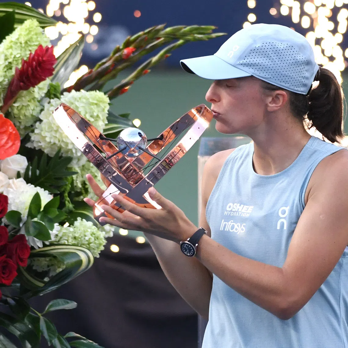 Aug 13, 2026; Toronto, Ontario, Canada; Iga Swiatek (POL) kisses the trophy after defeating Elena Rybakina (KAZ) during final round play at Sobeys Stadium. Mandatory Credit: Dan Hamilton-Imagn Images