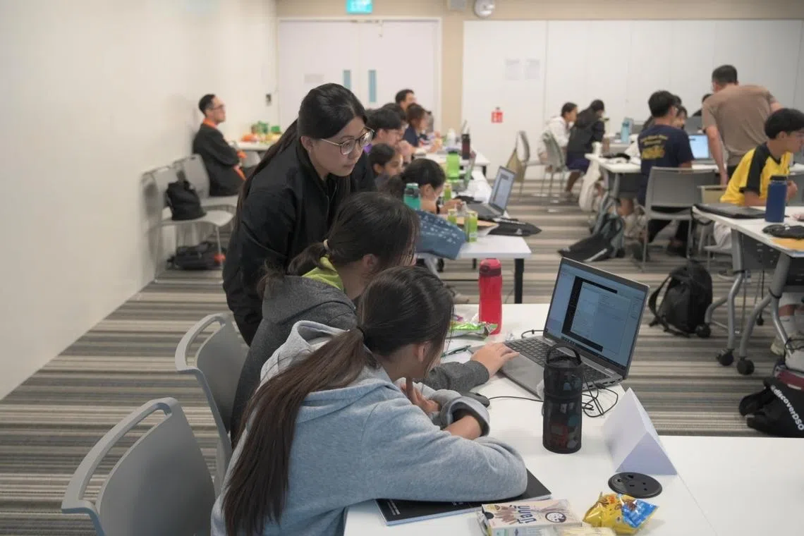 ms kwek conducting a science and technology workshop for secondary school students where she introduces them to aerodynamics software and real-world data analysis, exposure for dso staff at one of the best companies to work for in singapore