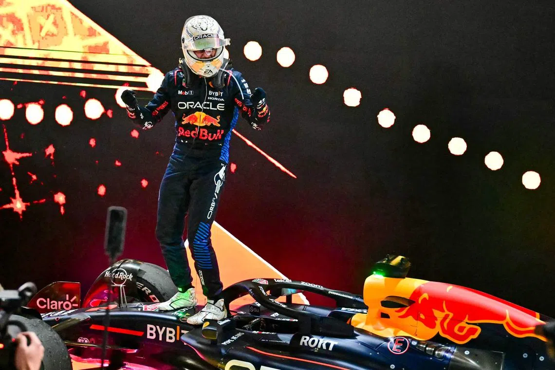Red Bull driver Max Verstappen celebrating after winning the Qatar Grand Prix.