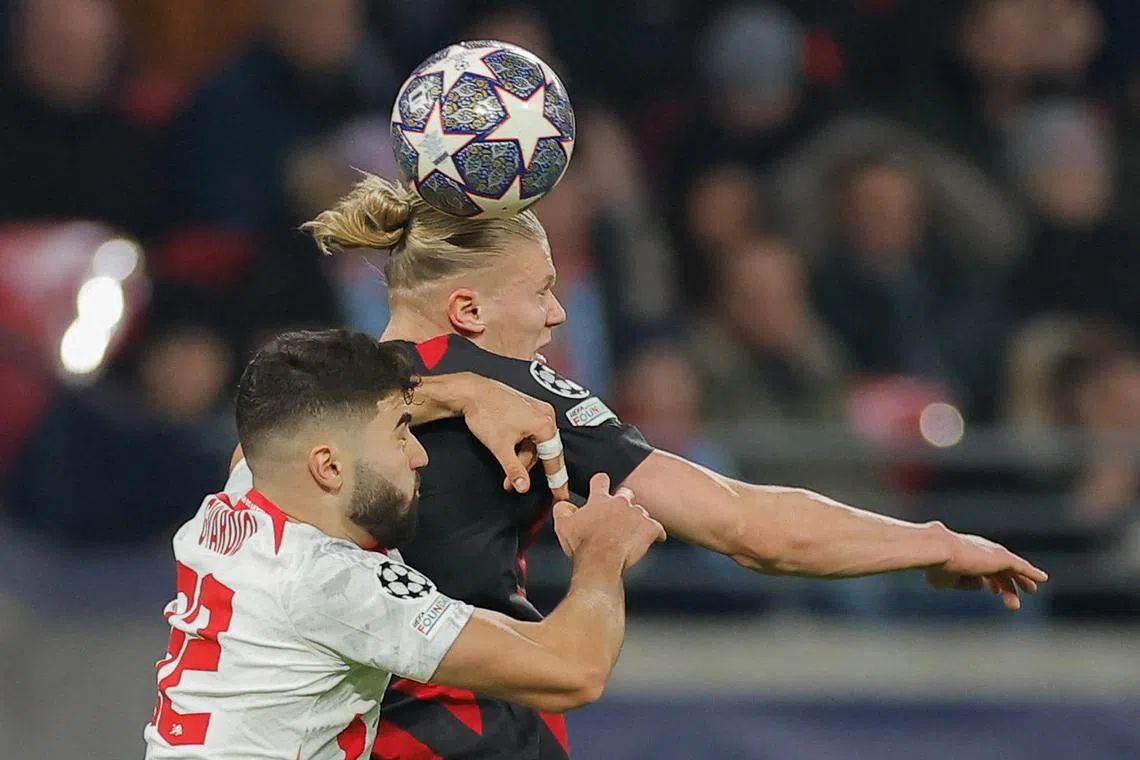 Manchester City's Erling Haaland (right) in action against Leipzig's Josko Gvardiol.