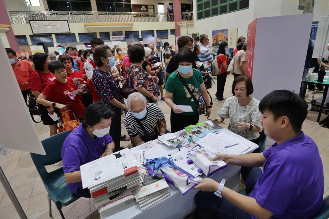 Residents attending the health carnival hosted by Ng Teng Fong General Hospital and Bukit Batok SMC at Bukit Batok Community Club on Aug 26.