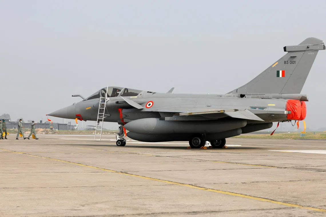 FILE PHOTO: Rafale fighter jet is seen parked on the tarmac during its induction ceremony at an air force station in Ambala, India, September 10, 2020. REUTERS/Adnan Abidi/File photo/File Photo