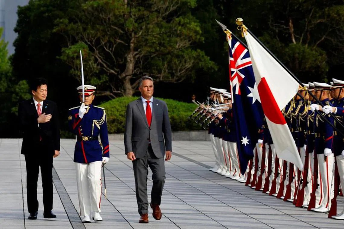 Japanese Defence Minister Minoru Kihara and Australia's Defence Minister and Deputy Prime Minister Richard Marles inspect an honor guard ahead of their meeting at the Defence Ministry in Tokyo, Japan, October 19, 2023. REUTERS/Kim Kyung-Hoon/Pool