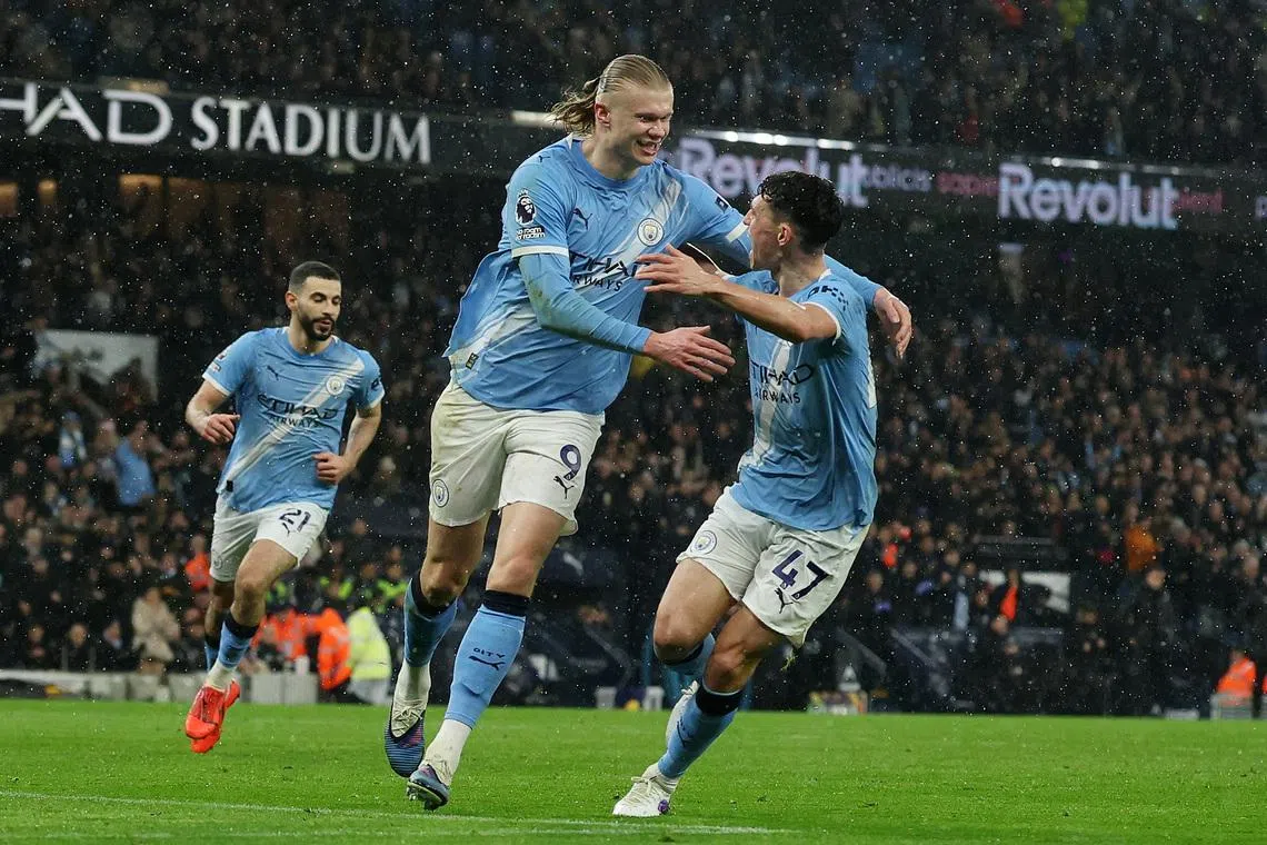 Soccer Football - Premier League - Manchester City v Fulham - Etihad Stadium, Manchester, Britain - February 11, 2026 Manchester City's Erling Haaland celebrates scoring their third goal with Phil Foden REUTERS/Phil Noble