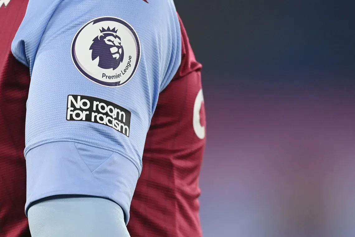 A ‘No room for racism’ badge is seen during a Premier League match.