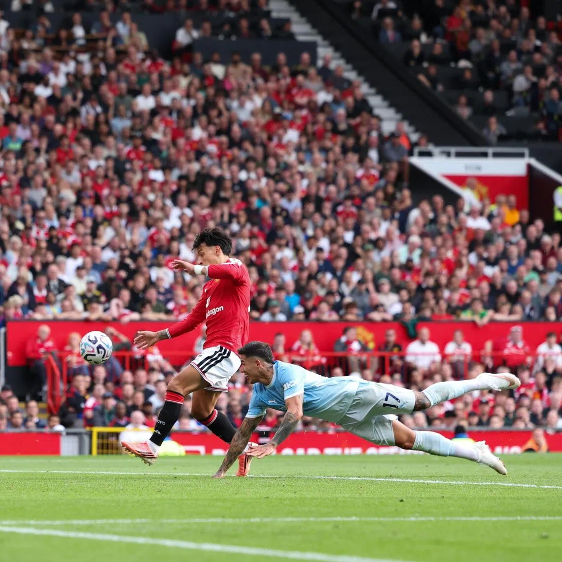 Manchester City’s Enzo Fernandez diving for the ball during the English Premier League match against Manchester United in Manchester, Britain, on Sept 13.