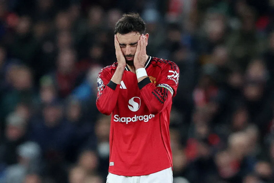 Soccer Football - Premier League - Manchester United v West Ham United - Old Trafford, Manchester, Britain - December 4, 2025  Manchester United's Bruno Fernandes looks dejected after West Ham United's Soungoutou Magassa scores their first goal REUTERS/Scott Heppell