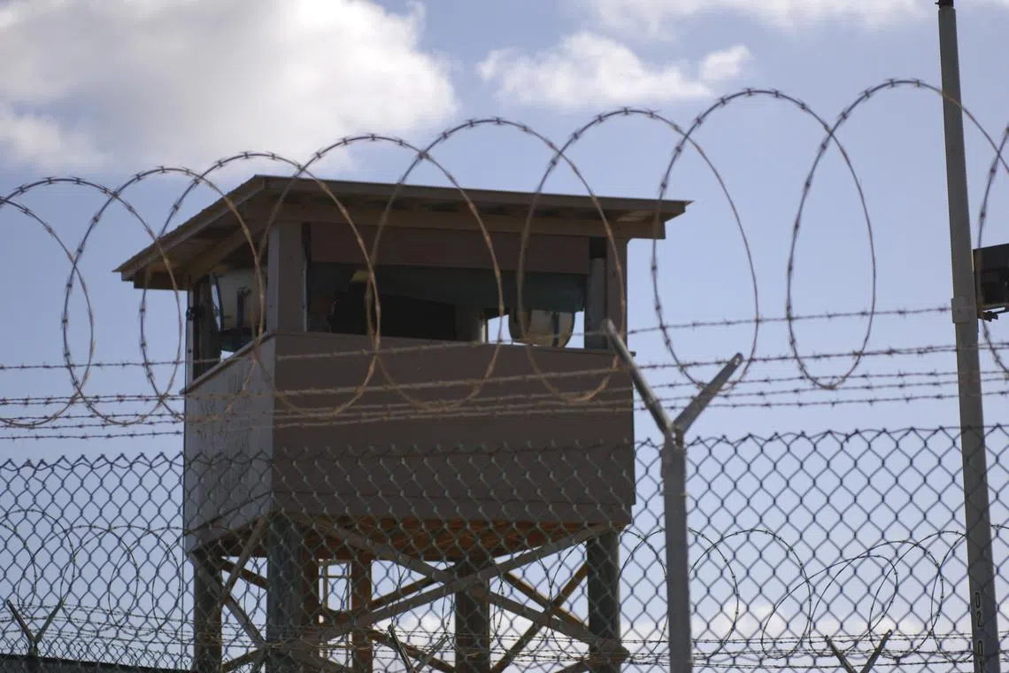 FILE PHOTO: A soldier stands guard in a tower at Guantanamo Bay naval base in a December 31, 2009 file photo provided by the US Navy. REUTERS/US Navy/Spc. Cody Black/Handout via Reuters/File Photo