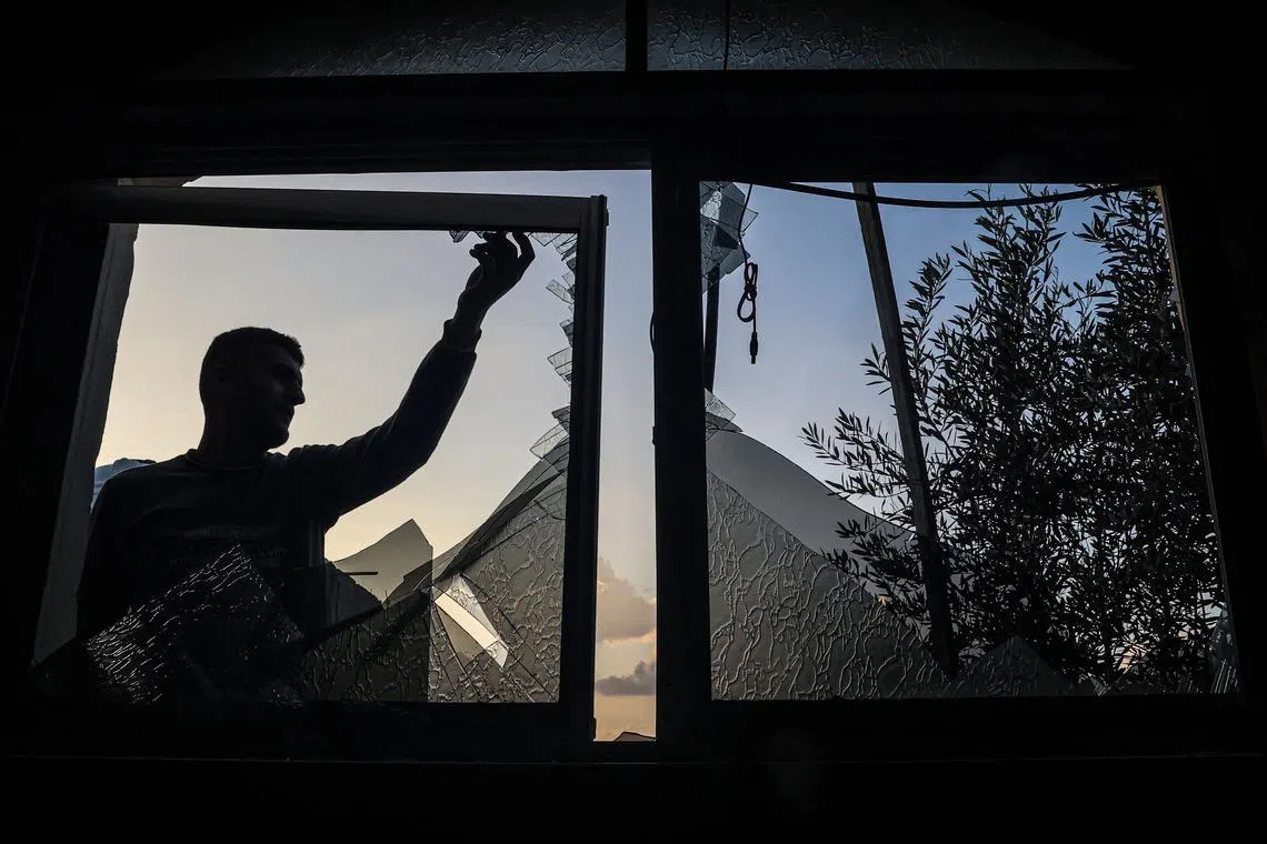 A Palestinian man checking a broken window following an Israeli strike in Rafah, in the southern Gaza Strip, on Feb 19, 2024.