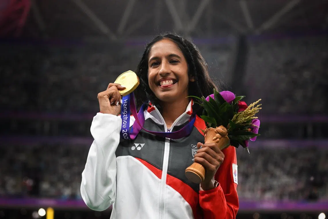 Singapore's sprint queen Shanti Pereira celebrates winning the Asian Games 200m final at the Hangzhou Olympic Sports Centre Stadium, on Oct 2, 2023.