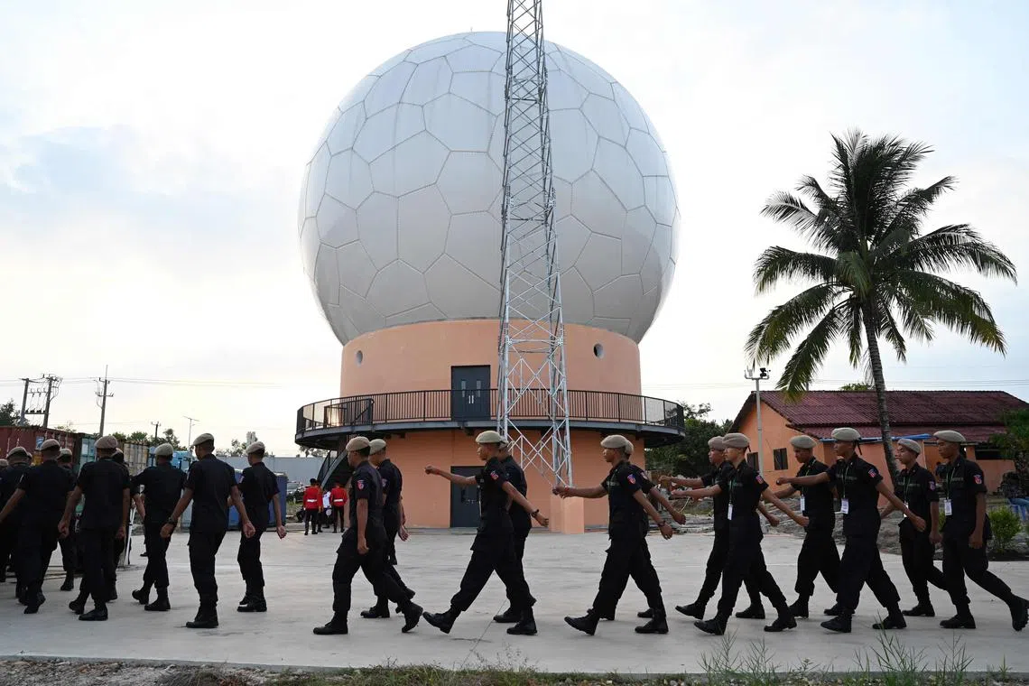 Cambodian soldiers walk in formation during The inauguration ceremony of the modernised infrastructure at Ream Naval Base and the Cambodia-China Joint Logistics and Training Center, Ream port in Preah Sihanouk province on April 5, 2025. 