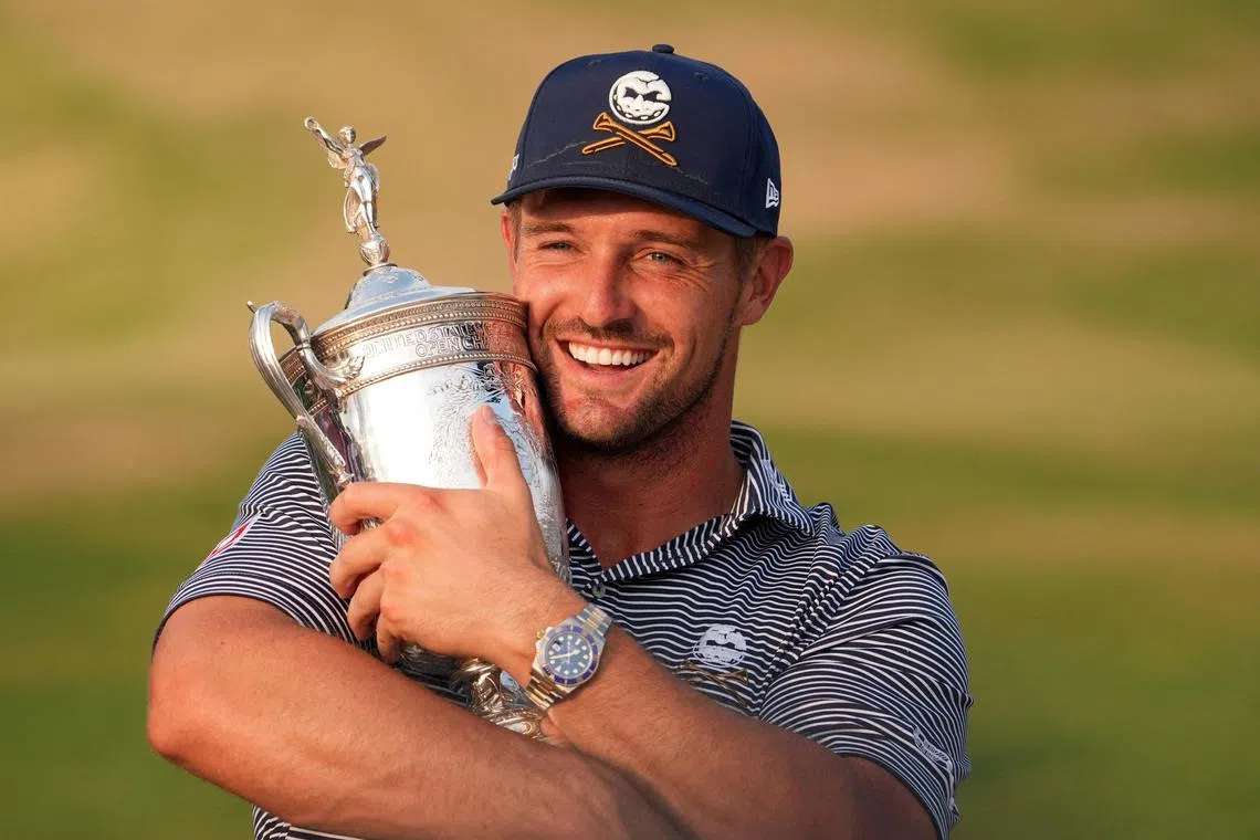 Bryson DeChambeau celebrates with the trophy after winning the US Open.
