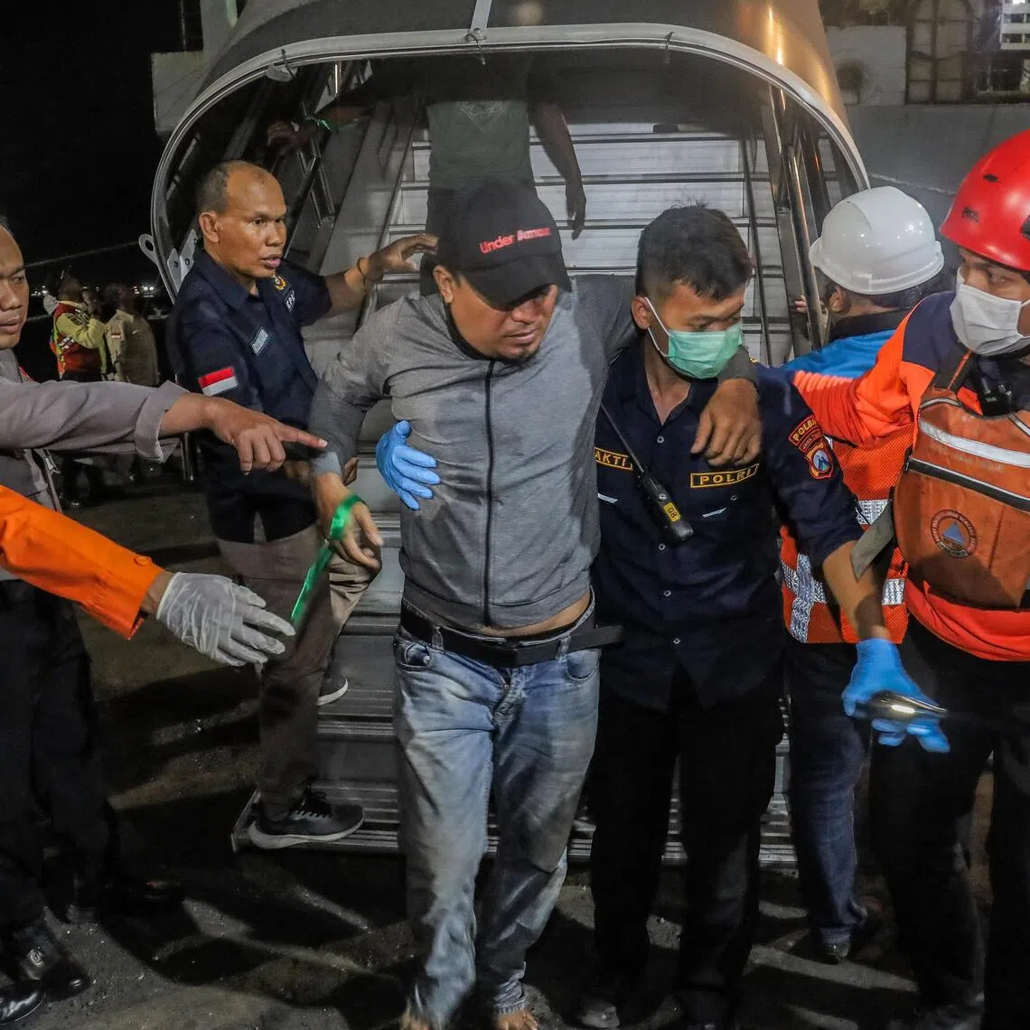 A survivor arrives at Tanjung Perak Port in Surabaya on Aug 3.