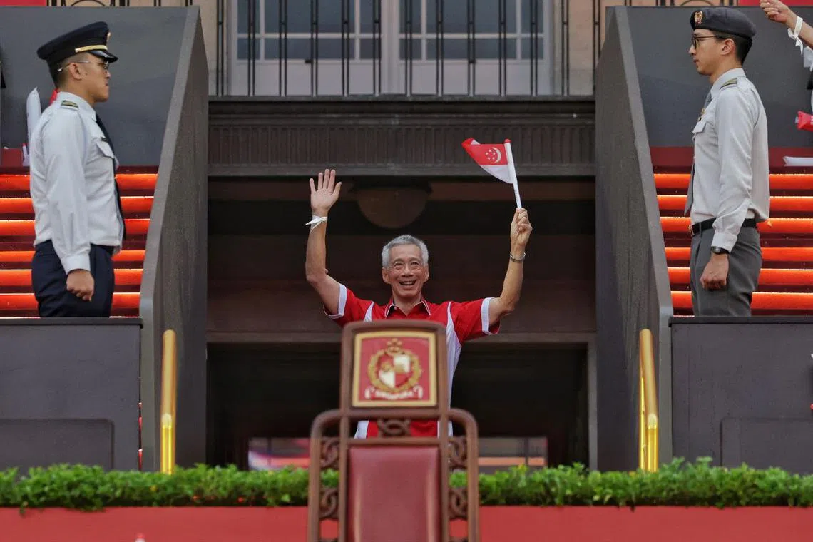 Senior Minister Lee Hsien Loong waving during National Day Parade at the Padang on Aug 9, 2024.