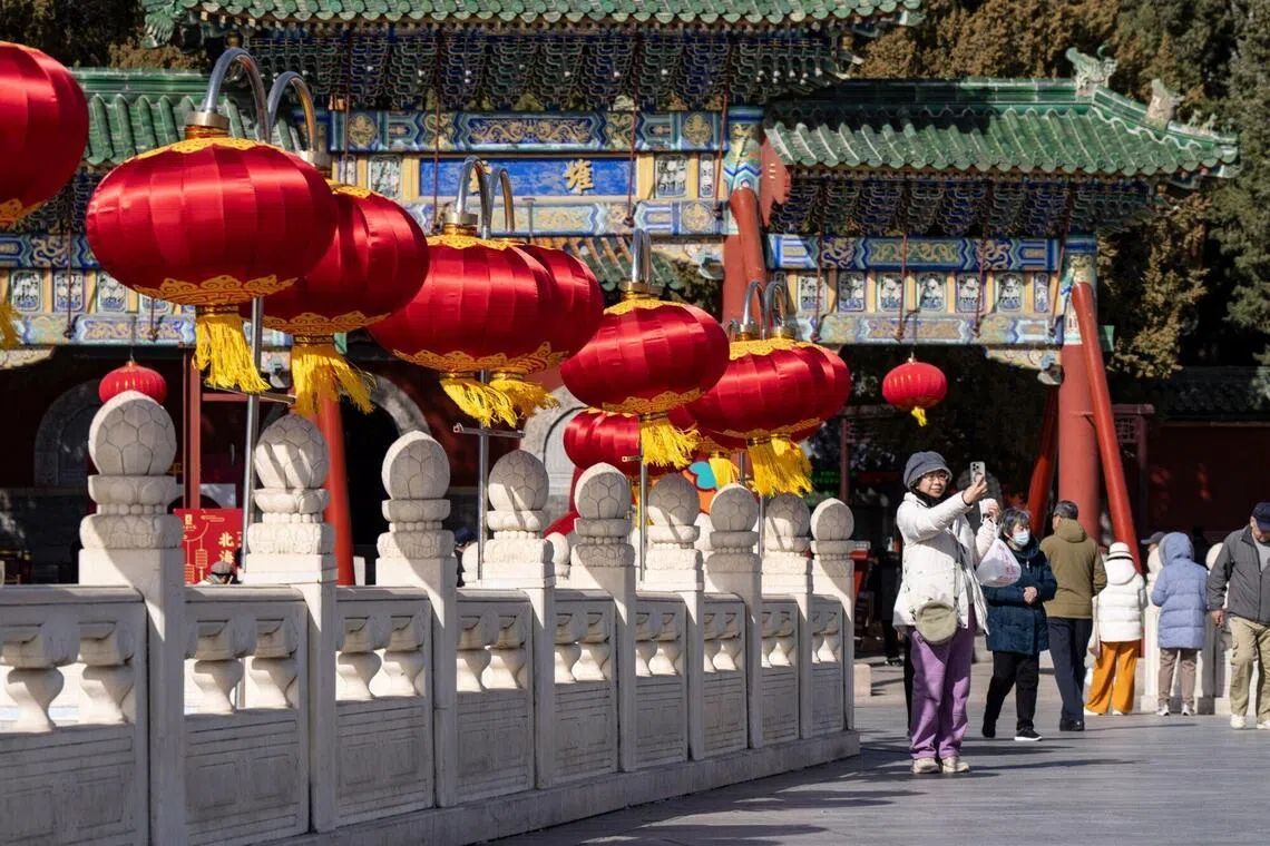 A visitor taking a selfie at Beihai Park in Beijing on March 3.