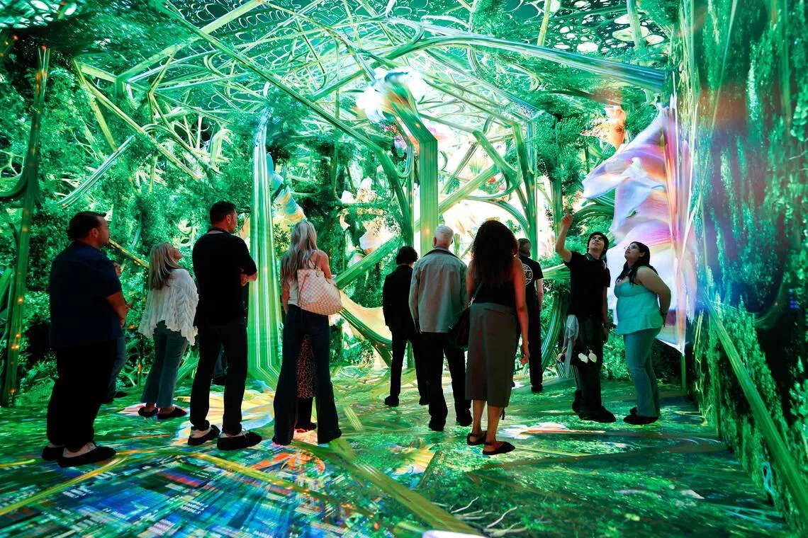 Visitors experience Dataland, the “world’s first Museum of AI Arts,” on opening day on June 20, 2026 in Los Angeles, California.
