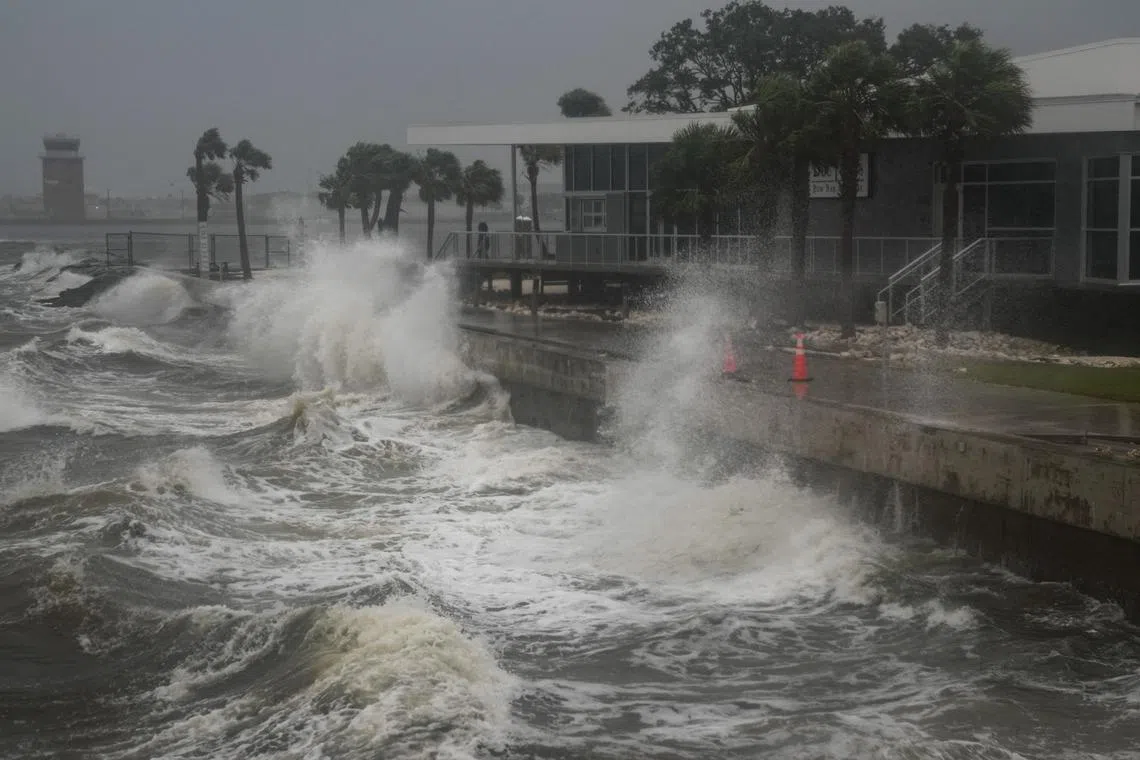 Waves crash along St. Pete Pier in St. Petersburg, Florida, as Hurricane Milton is expected to make landfall on Oct 9, 2024. 
