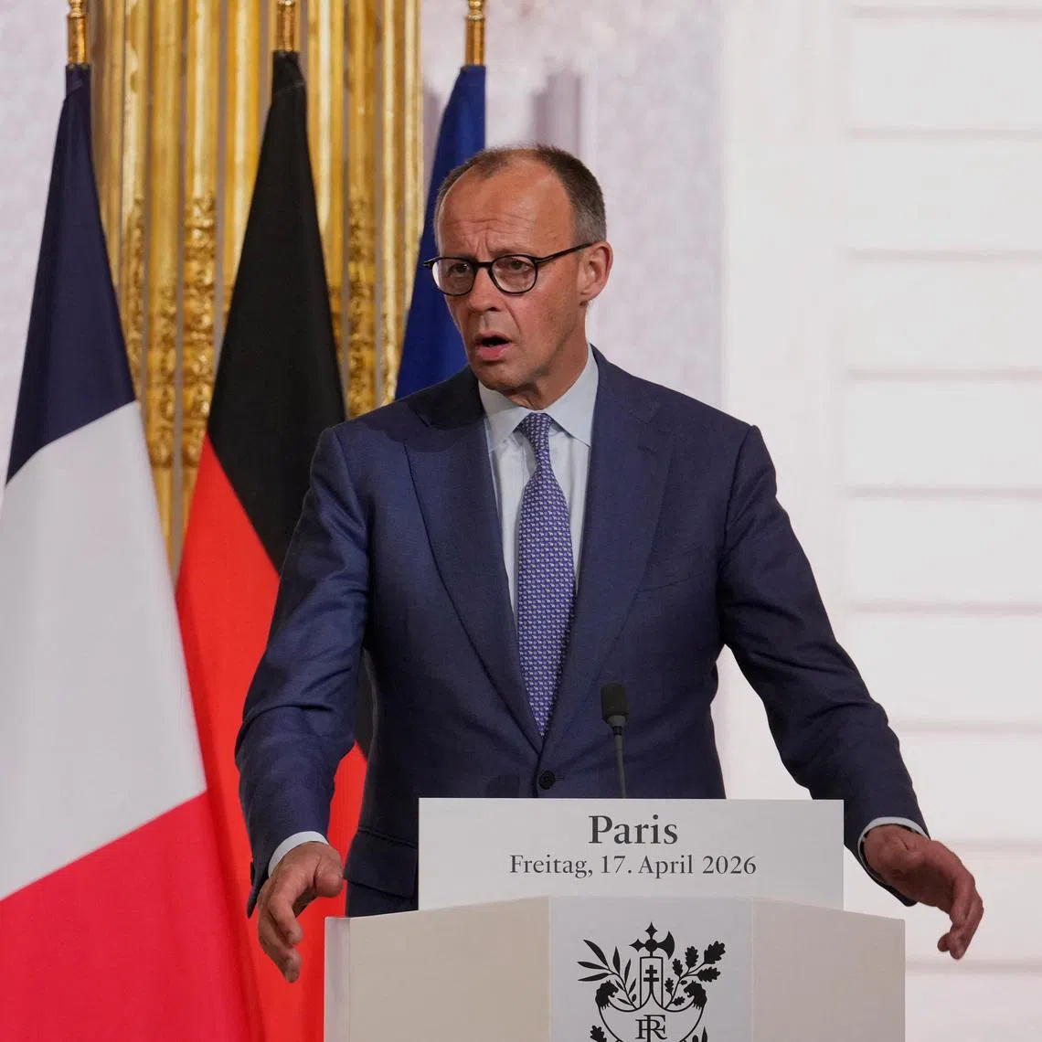 FILE PHOTO: German Chancellor Friedrich Merz gives a statement at the end of an international summit to push forward efforts to reopen the Strait of Hormuz, at the Elysee Palace, in Paris, France, Friday, April 17, 2026.   Michel Euler/Pool via REUTERS/File Photo